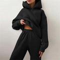 Chándal oversize Kythera de mujer en negro: sudadera con capucha y pantalón cargo